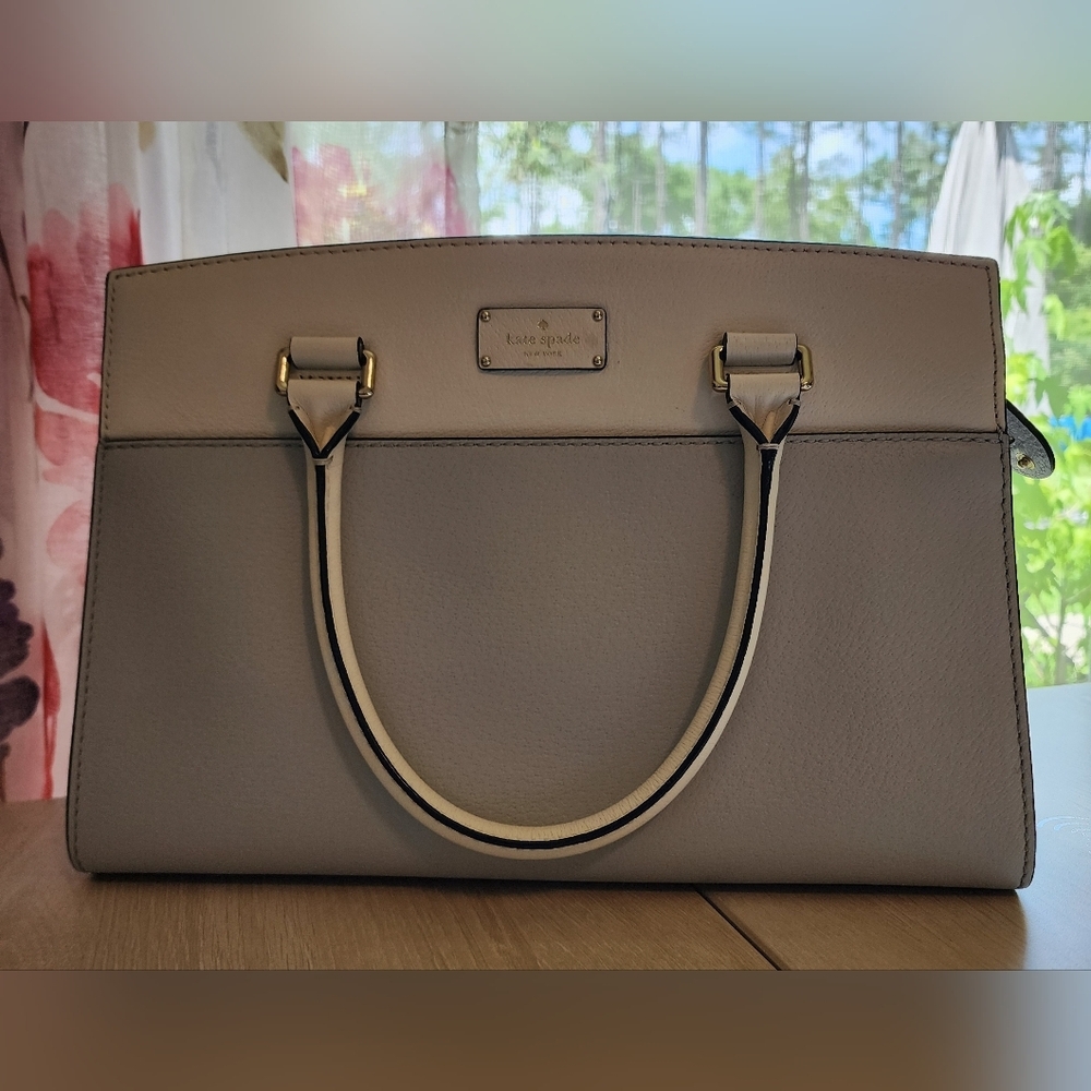 Well loved Kate Spade New York two-tone handbag